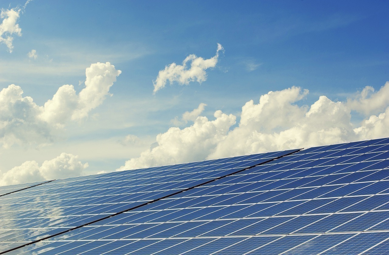 Sustainable Eco Resort Design: Best Practices for Indonesian Beach Properties with solar panels on resort rooftops